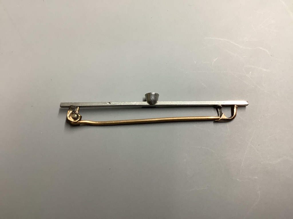 A paste set yellow and white metal bar brooch, 56mm